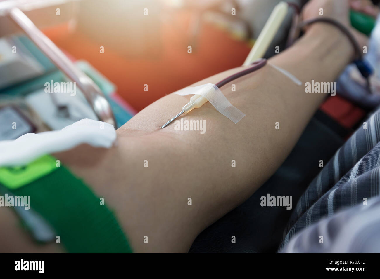 Nurse receiving blood from blood donor in hospital. Stock Photo