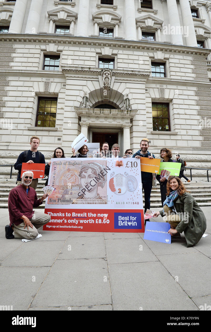 Supporters of campaign group Best for Britain outside the Treasury in central London, holding up a new £10note that features Jane Austen with the message that the new tenner is only 'worth £8.60' thanks to the devaluation of the pound since the referendum vote. Stock Photo