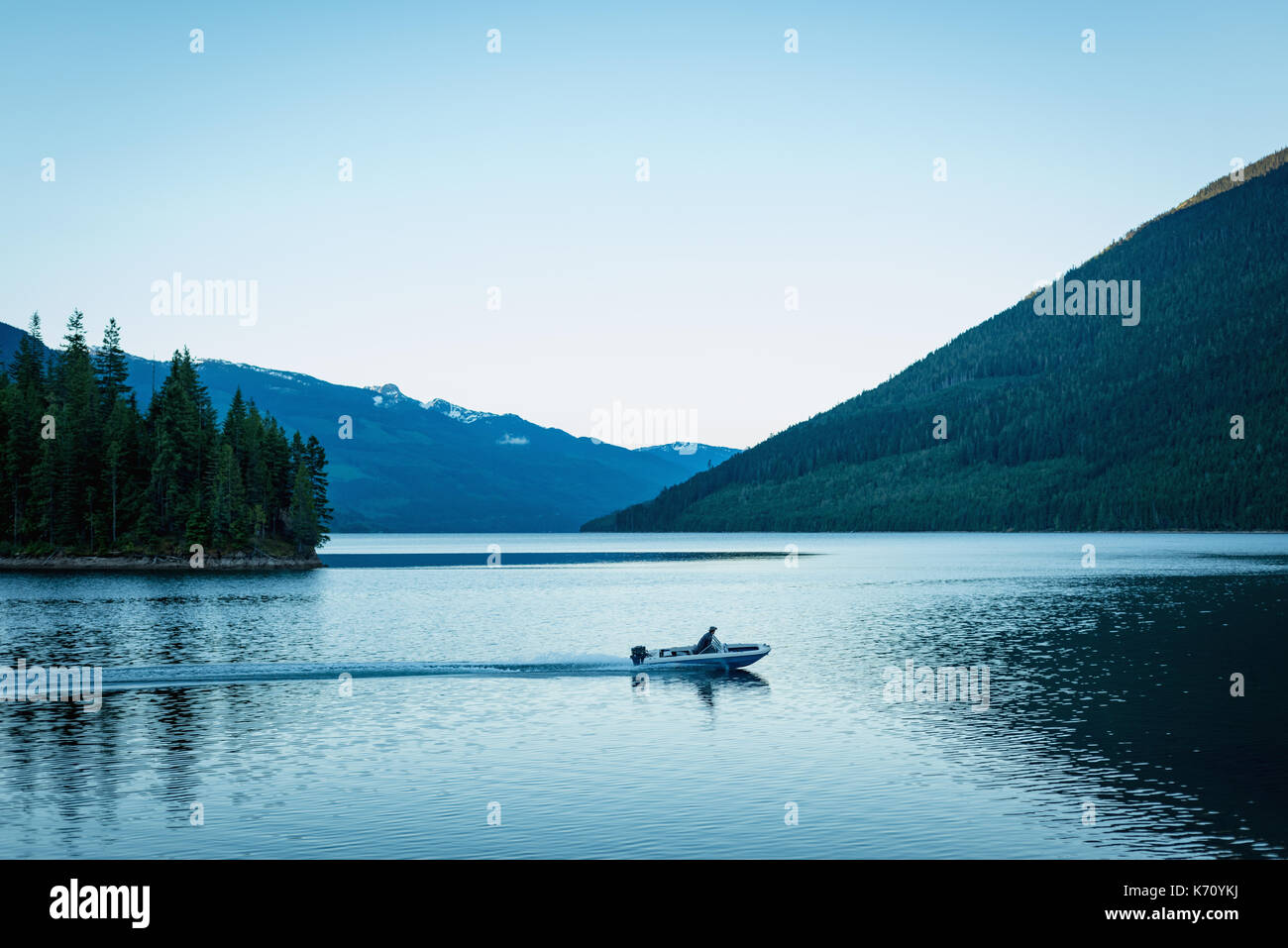 Boy driving boat hi-res stock photography and images - Alamy