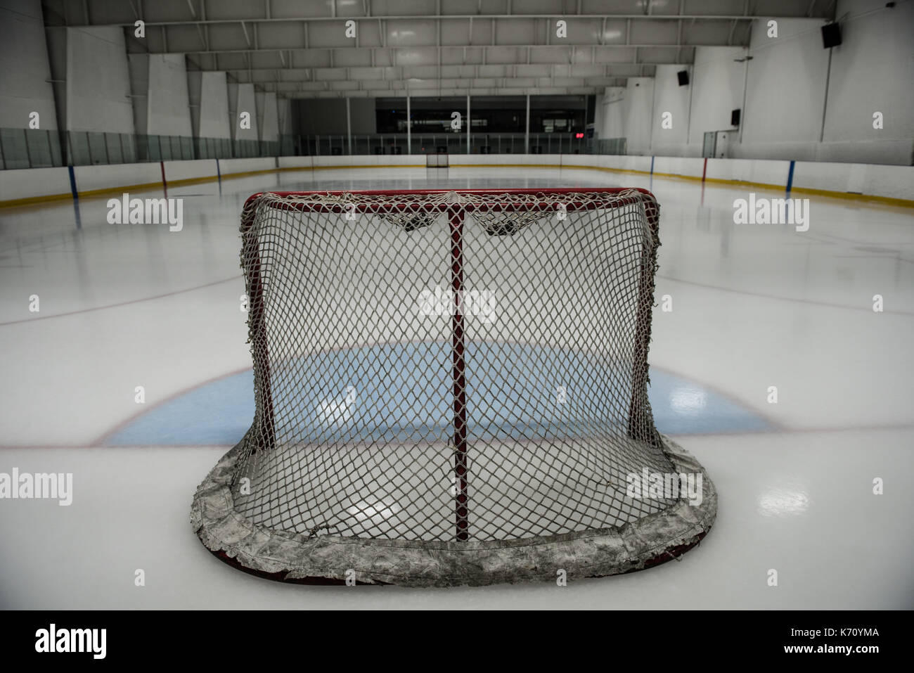 Goal post at empty illuminated ice hockey rink Stock Photo Alamy