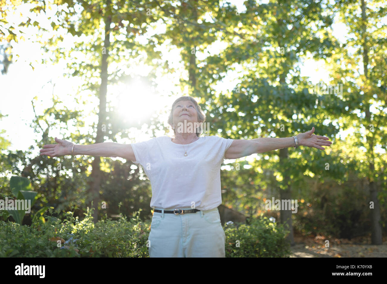 Senior woman arms outstretched hi-res stock photography and images - Alamy