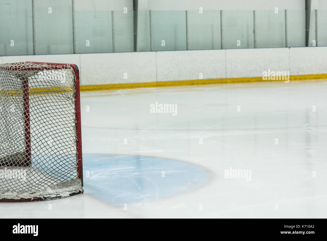 Goal post at empty ice hockey rink Stock Photo Alamy