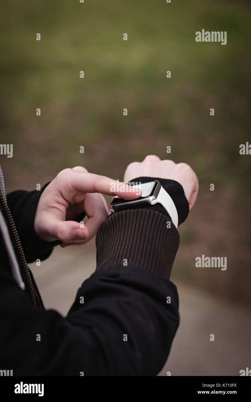Close-up of womans hand using smartwatch Stock Photo