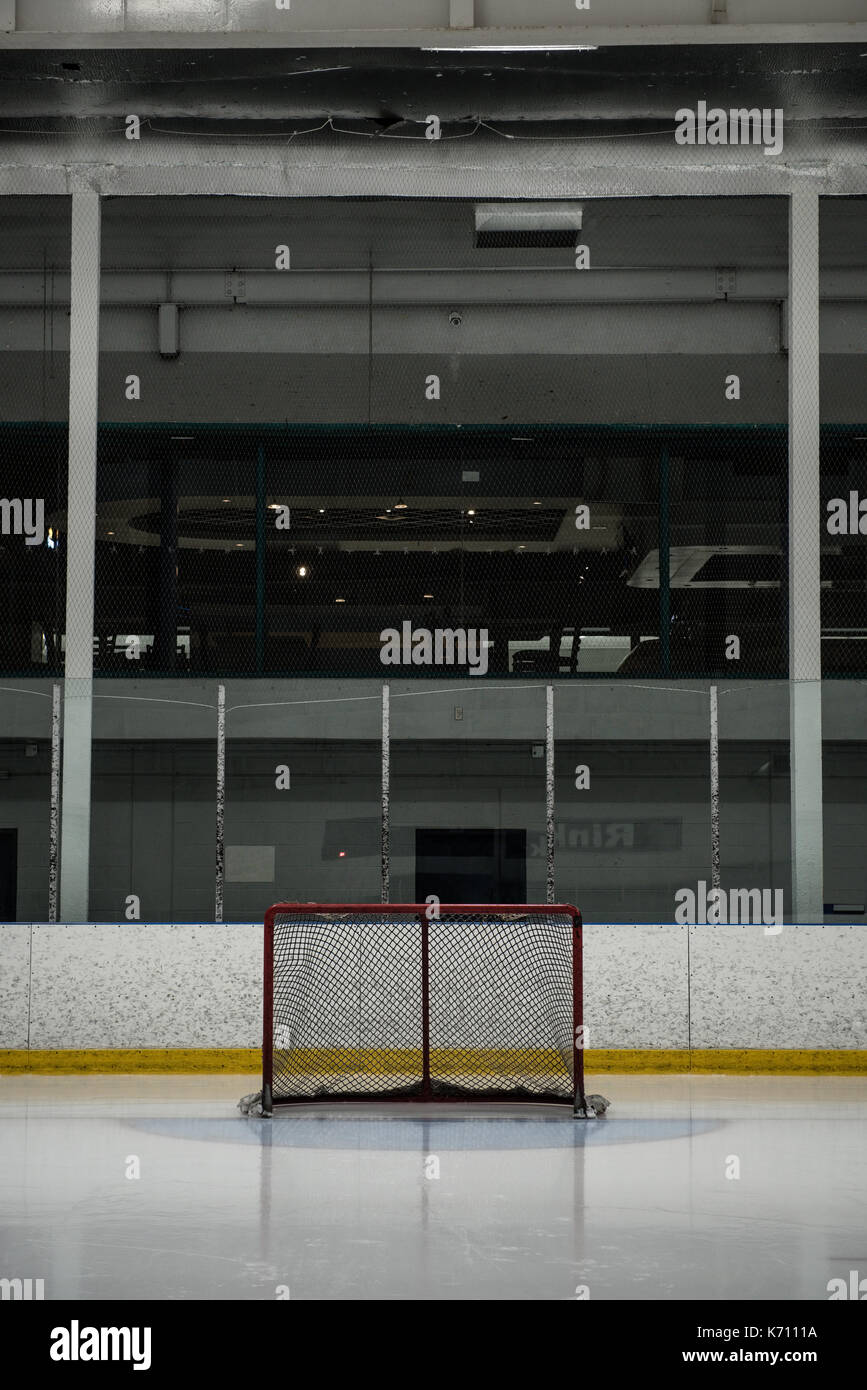 Goal post at empty ice hockey rink Stock Photo