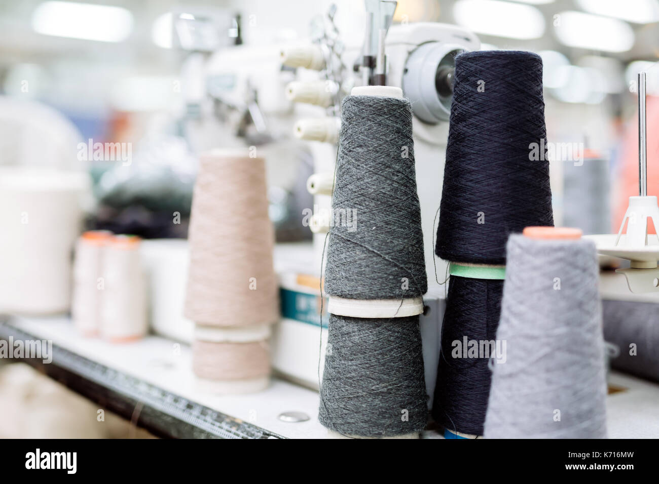 Wool and thread spools on desk Stock Photo - Alamy