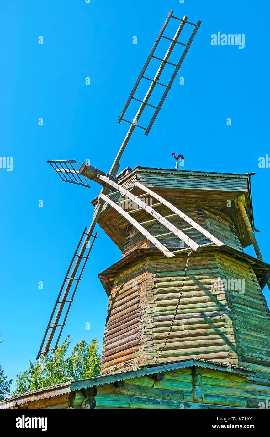 The wooden blades of historic log windmill, decorated with the wooden ...