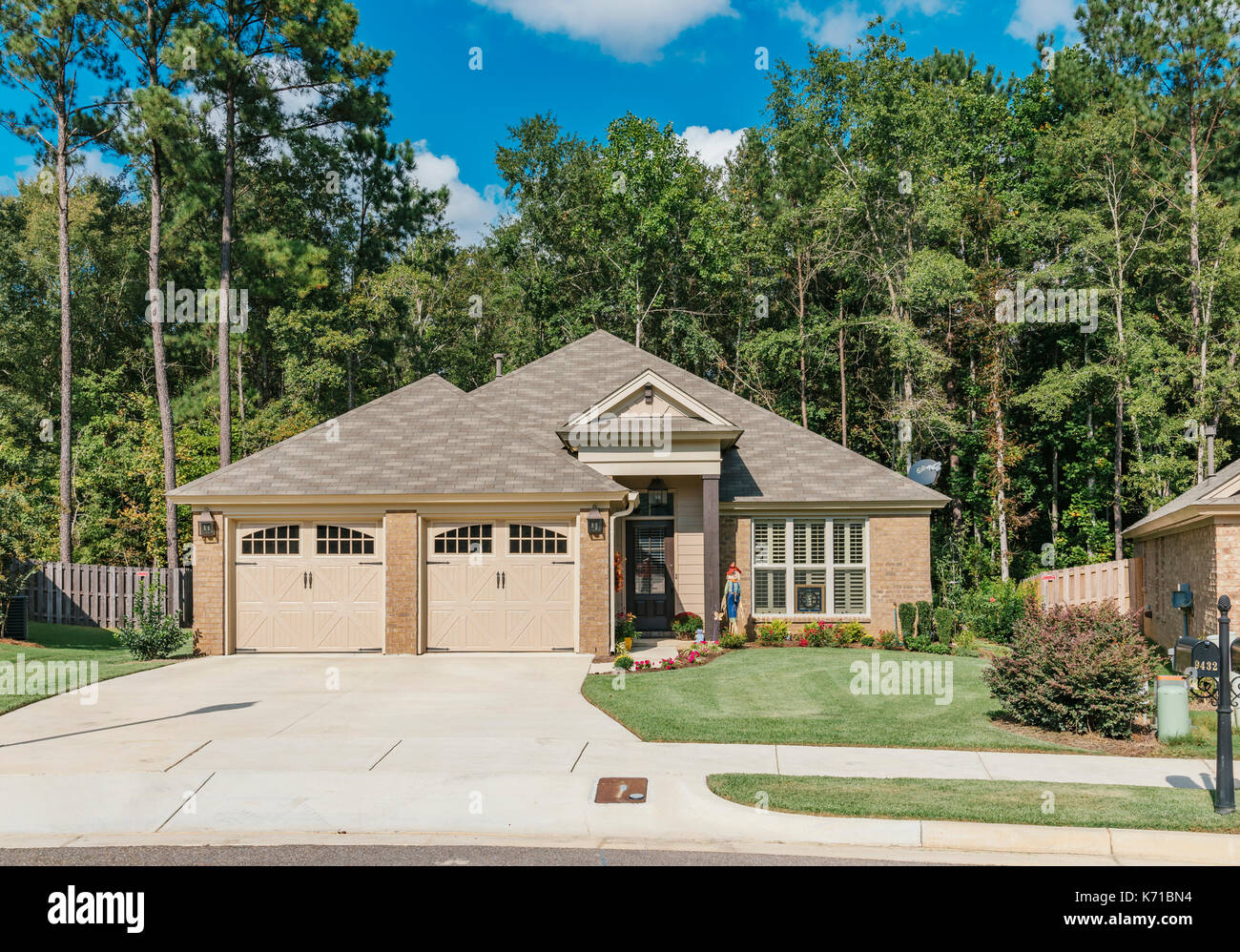 Exterior of new brick home or house in a suburban neighborhood in the suburbs of Montgomery Alabama, USA. Stock Photo