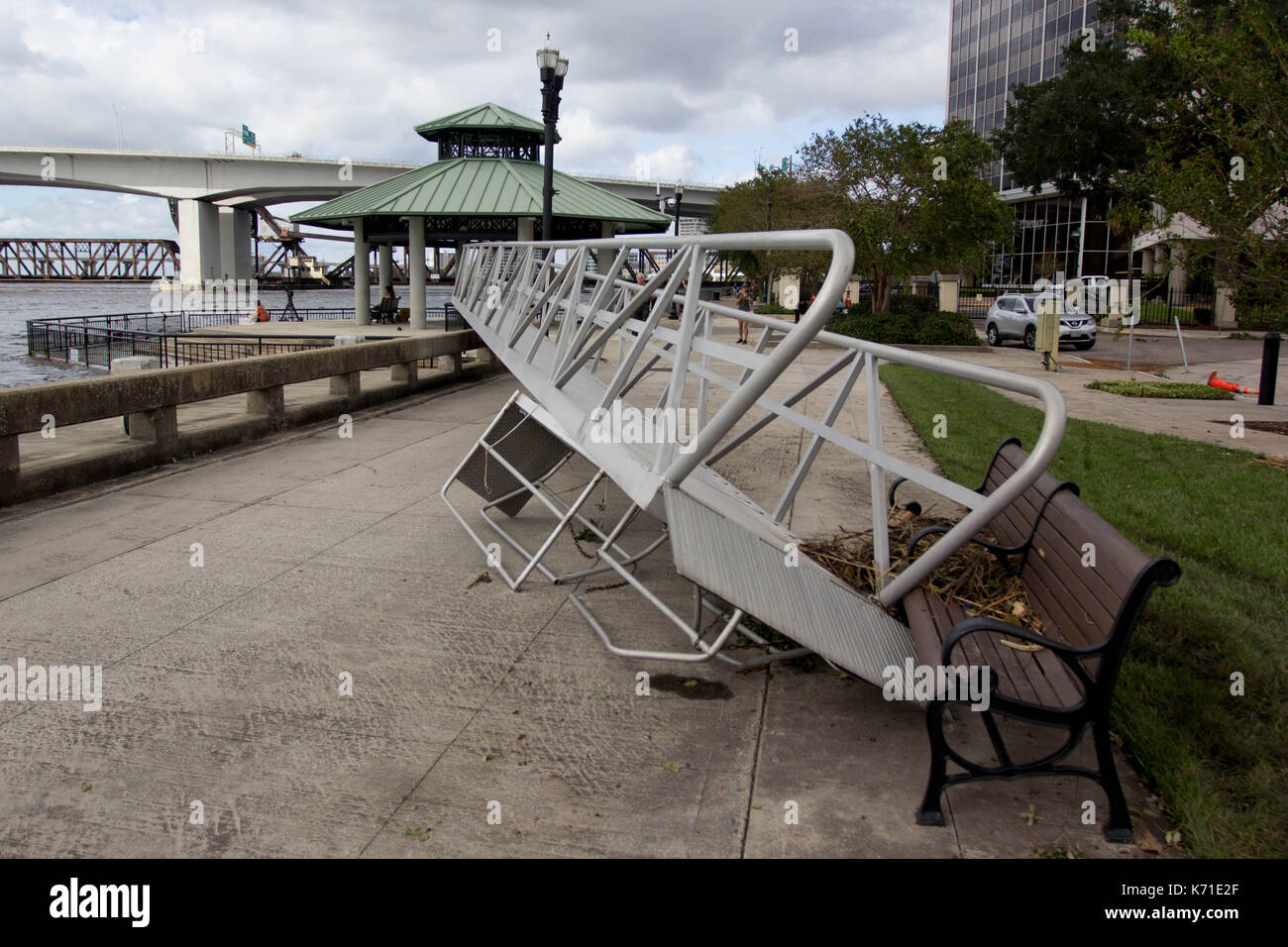 A boat ramp torn from its dock and strewen across the sidewalk in