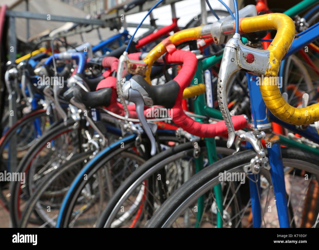 many vintage racing bikes for sale in the flea market alfresco in a city Stock Photo