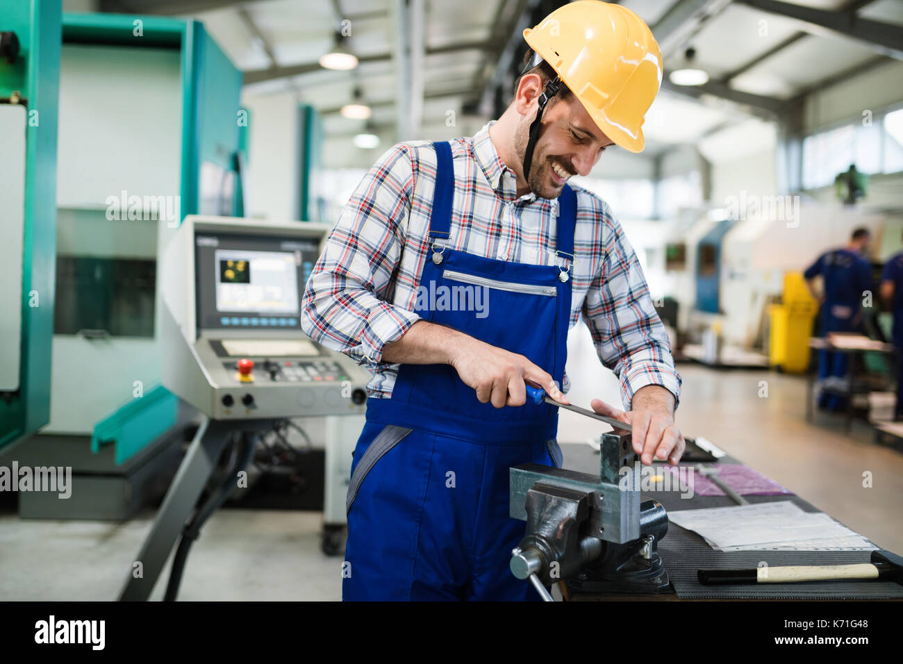 modern industrial machine operator working in factory Stock Photo - Alamy
