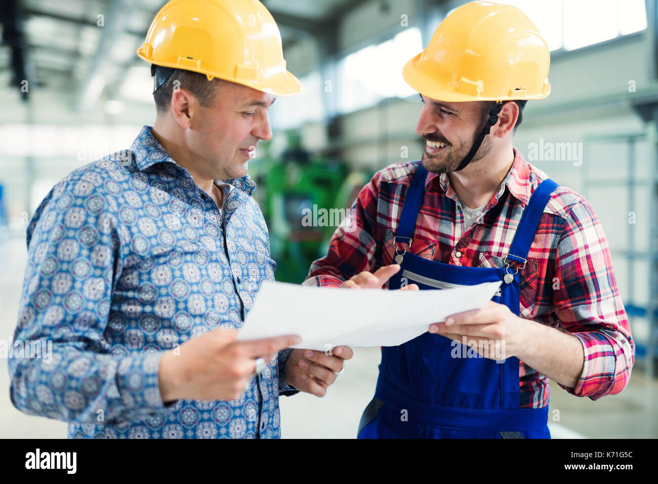 Supervisor and engineer working in metal industry Stock Photo