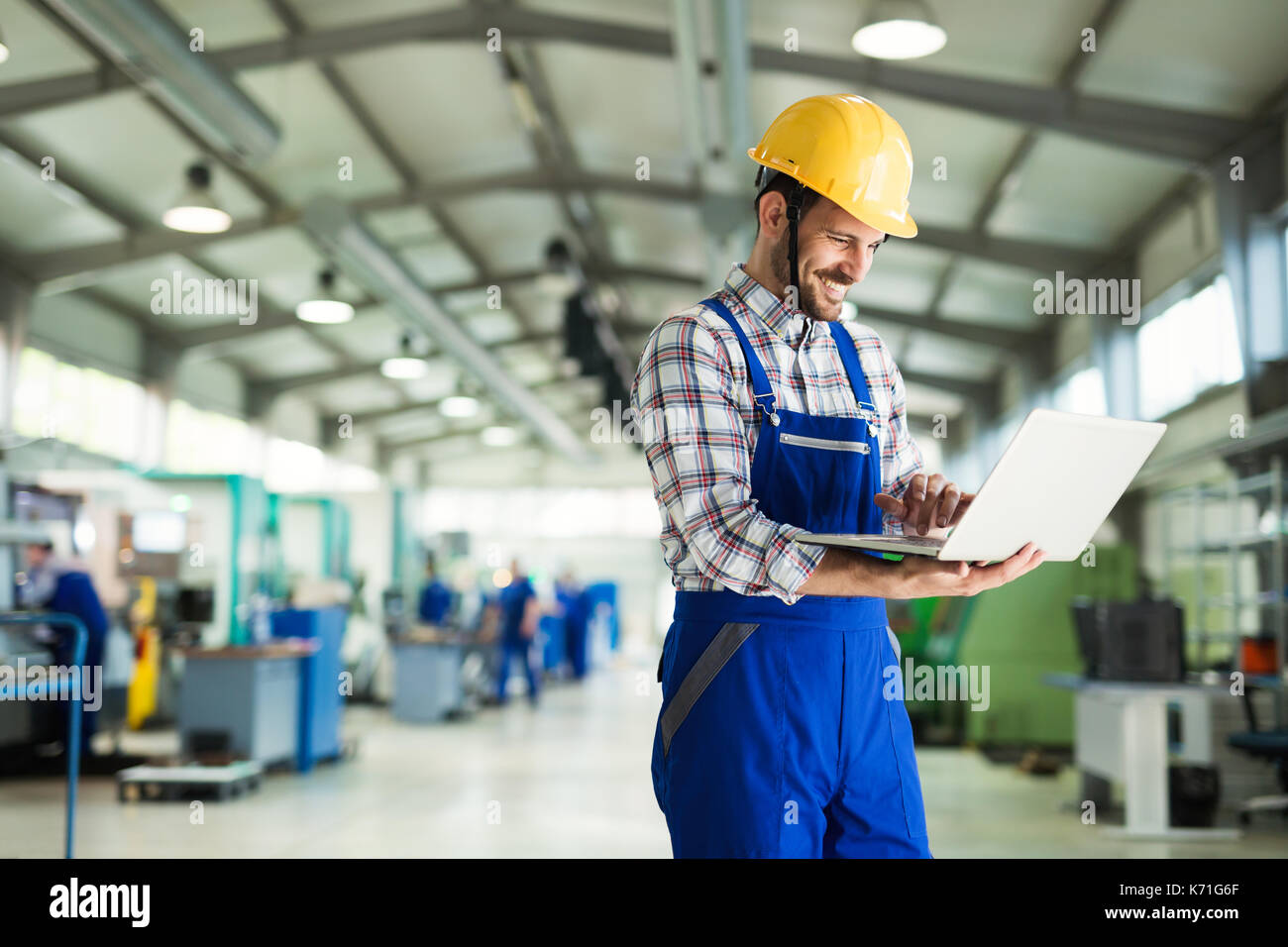 modern industrial machine operator working in factory Stock Photo Alamy