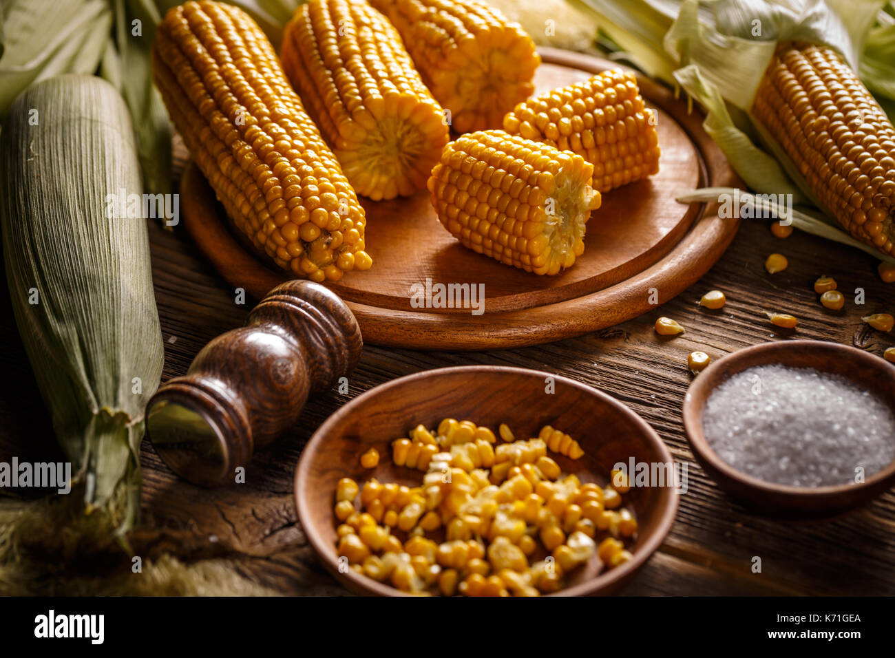 Boiled sweet corn on wooden board Stock Photo