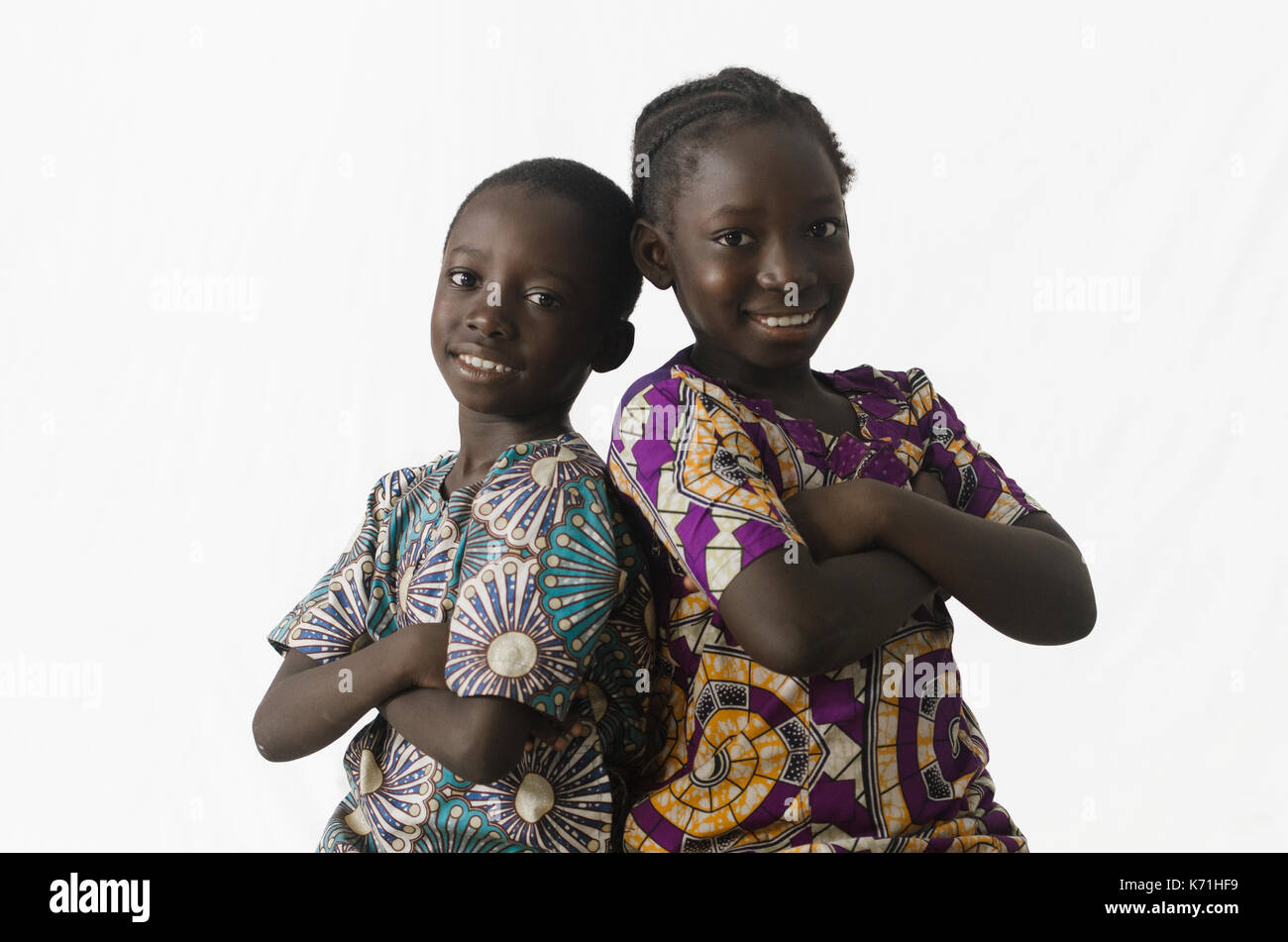 Couple of African brother and sister posing in studio, isolated on white Stock Photo