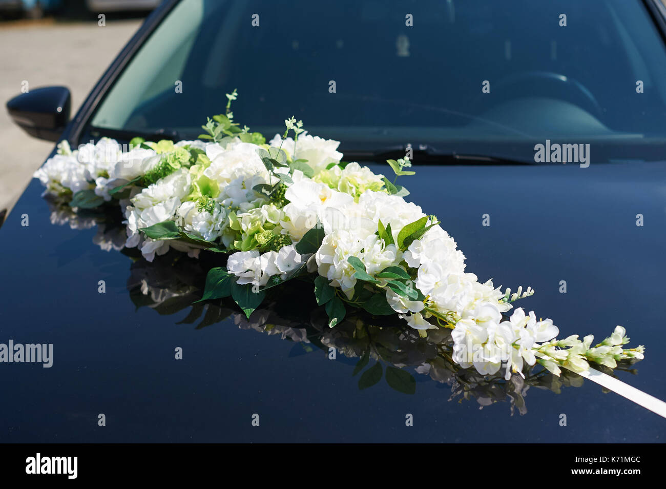 decorated with flowers wedding car of the bride and groom Stock Photo