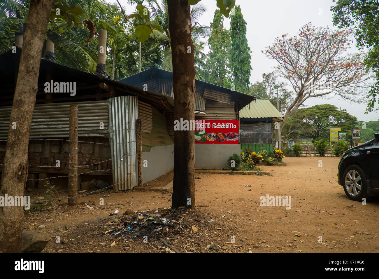 A typical road side eatery in Wayanad, Kerala, serves as a convenient stop for a quick filter coffe, snacks or meals and relieving oneself. Stock Photo