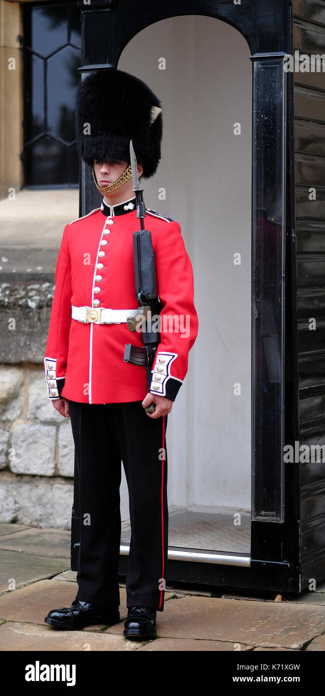Beefeater sentry guarding The Tower, London, UK Stock Photo