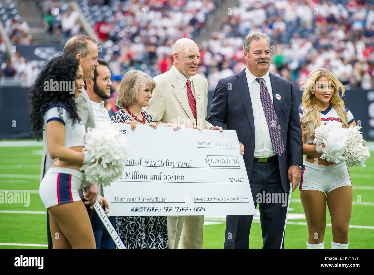 September 10, 2017: Houston Texans owners Bob and Cal McNair, along with others, display a million dollar check for the United Way Relief Fund to help with Hurricane Harvey recovery efforts prior to an NFL football game between the Houston Texans and the Jacksonville Jaguars at NRG Stadium in Houston, TX. The Jaguars won the game 29-7...Trask Smith/CSM Stock Photo