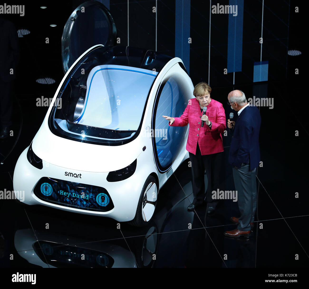 Frankfurt, Germany. 14th Sep, 2017. German Chancellor Angela Merkel (L) speaks to Dieter Zetsche, chairman of German car maker Daimler AG and head of Mercedes-Benz cars, on the opening day of the 67th Frankfurt International Motor Show (IAA), Germany, on Sept. 14, 2017. Credit: Luo Huanhuan/Xinhua/Alamy Live News Stock Photo