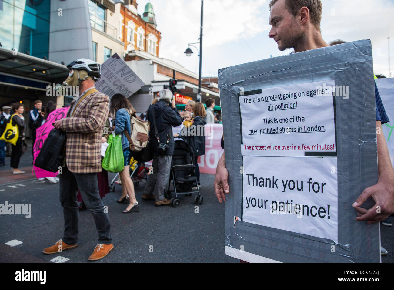 London, UK. 14th Sep, 2017. Environmental activists from Stop Killing Londoners and Mums for Lungs block Brixton Road in front of Brixton station at rush hour as part of a protest demanding urgent attention to prevent premature deaths from air pollution. Levels of nitrogen dioxide, linked to 9,500 early deaths a year in London, recorded in Brixton Road have repeatedly breached the EU limit. Credit: Mark Kerrison/Alamy Live News Stock Photo