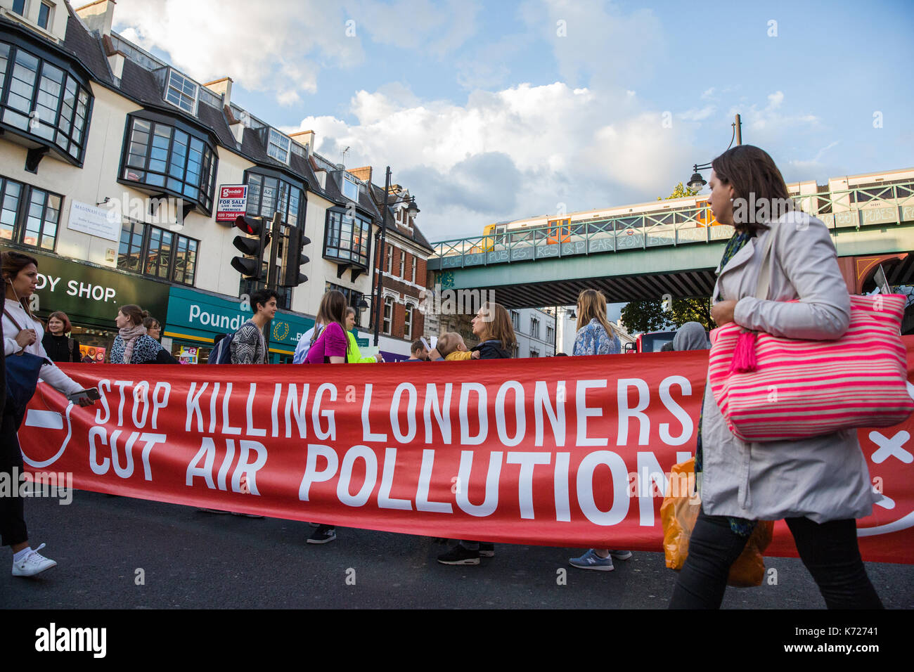 London, UK. 14th Sep, 2017. Environmental activists from Stop Killing Londoners and Mums for Lungs block Brixton Road in front of Brixton station at rush hour as part of a protest demanding urgent attention to prevent premature deaths from air pollution. Levels of nitrogen dioxide, linked to 9,500 early deaths a year in London, recorded in Brixton Road have repeatedly breached the EU limit. Credit: Mark Kerrison/Alamy Live News Stock Photo