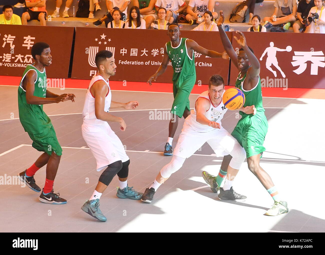 Xiamen, China's Fujian Province. 14th Sep, 2017. Benjamin Michael Bowie (2nd R) from Lincoln University of New Zealand vies for the ball during the 3X3 FISU World University League-2017 Finals between Lincoln University of New Zealand and Makerere University of Uganda, in Xiamen, southeast China's Fujian Province, Sept. 14, 2017. Credit: Lin Shanchuan/Xinhua/Alamy Live News Stock Photo