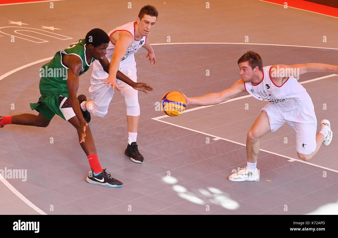 Xiamen, China's Fujian Province. 14th Sep, 2017. James Michael Cawthorn (R) from Lincoln University of New Zealand vies for the ball during the 3X3 FISU World University League-2017 Finals between Lincoln University of New Zealand and Makerere University of Uganda, in Xiamen, southeast China's Fujian Province, Sept. 14, 2017. Credit: Lin Shanchuan/Xinhua/Alamy Live News Stock Photo