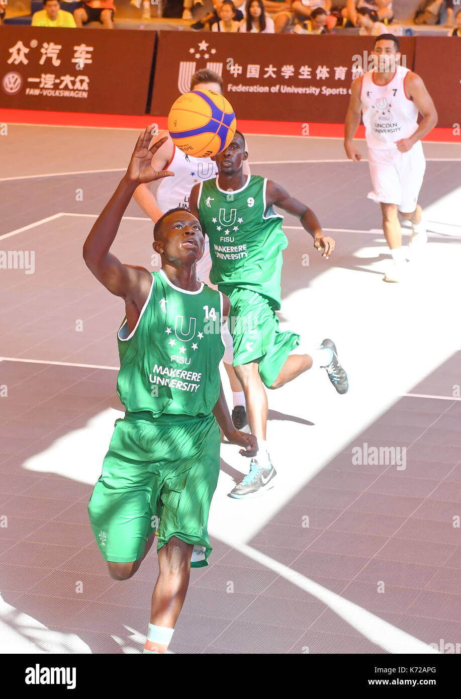 Xiamen, China's Fujian Province. 14th Sep, 2017. Awill Bazil (front) from Makerere University of Uganda goes to the basket during the 3X3 FISU World University League-2017 Finals between Lincoln University of New Zealand and Makerere University of Uganda, in Xiamen, southeast China's Fujian Province, Sept. 14, 2017. Credit: Lin Shanchuan/Xinhua/Alamy Live News Stock Photo