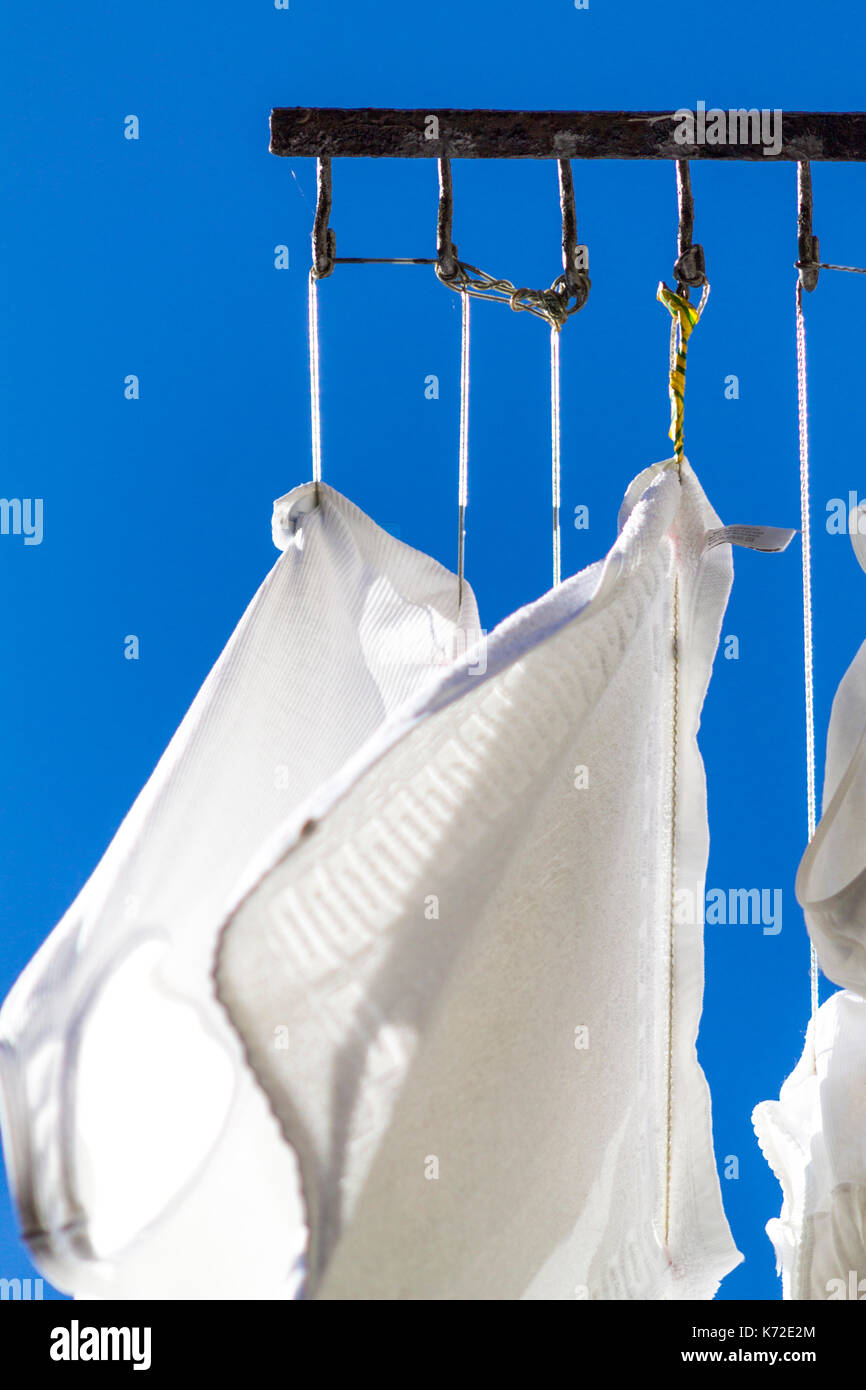 Drying laundry on a blue sky Stock Photo Alamy