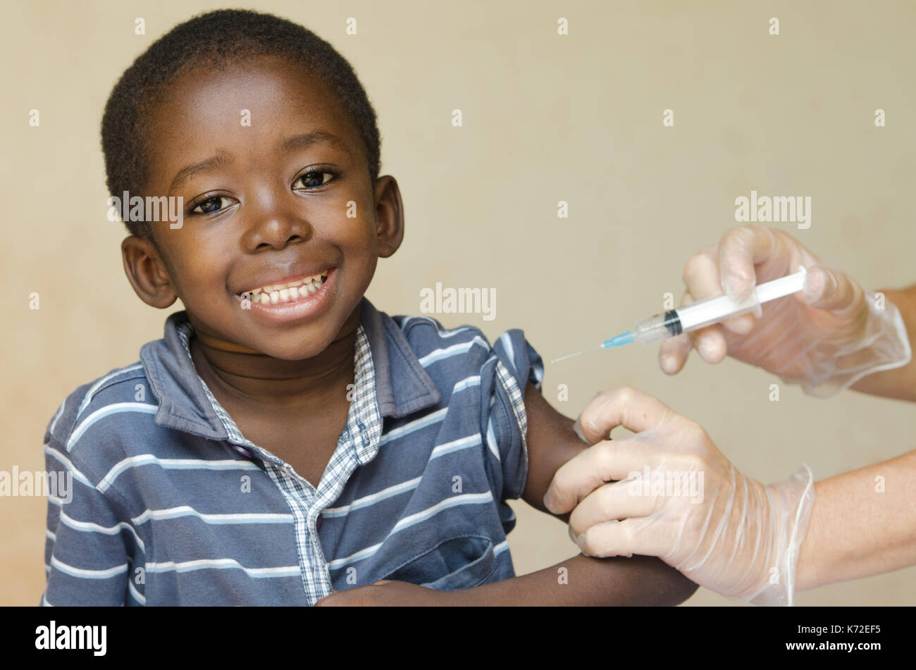 African boy happy about getting a vaccination Stock Photo
