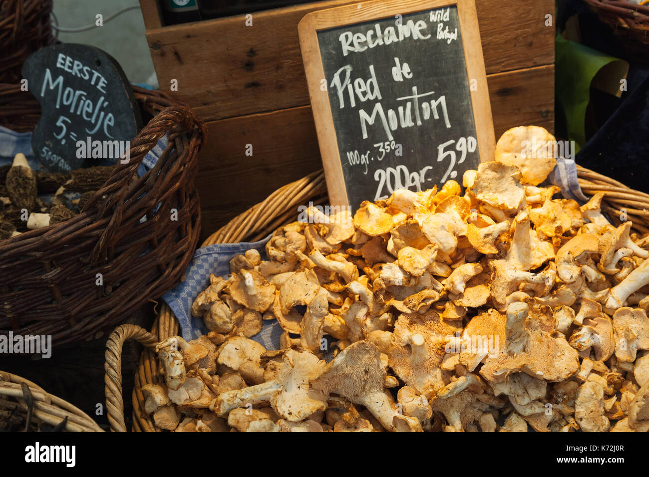 Amsterdam, Netherlands - February 25, 2017: Hedgehog mushrooms. Goods of outdoor market Noordermarkt with vendors selling an array of goods such as an Stock Photo