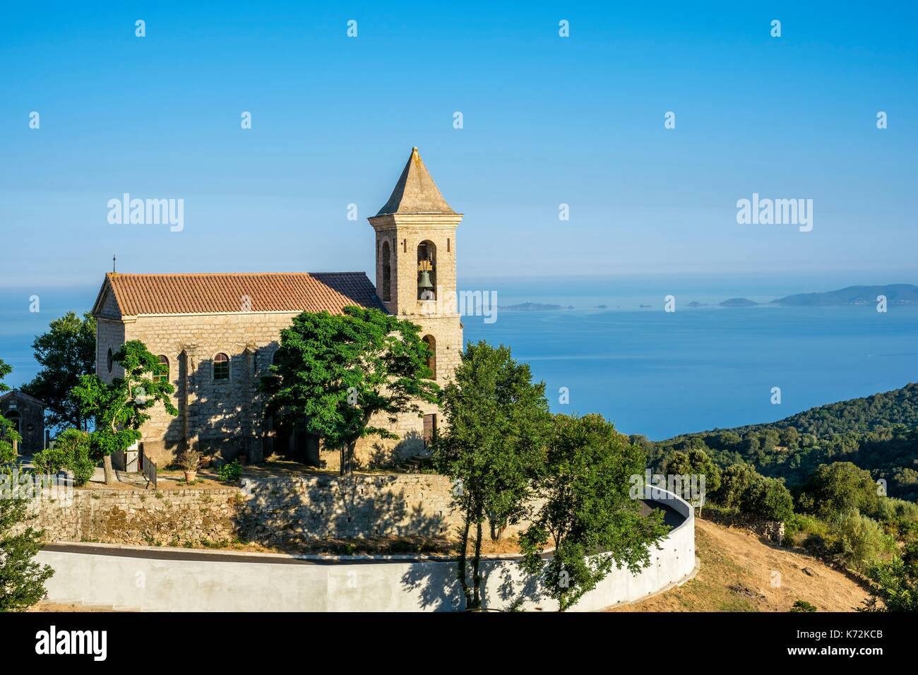 France, Corse-du Sud (2A), Prunelli region, Mare e Monti Sud hiking trail,  between Porto Pollo and Coti-Chiavari, Coti-Chiavari village,  Saint-Jean-Baptiste church and the Gulf of Ajaccio Stock Photo - Alamy