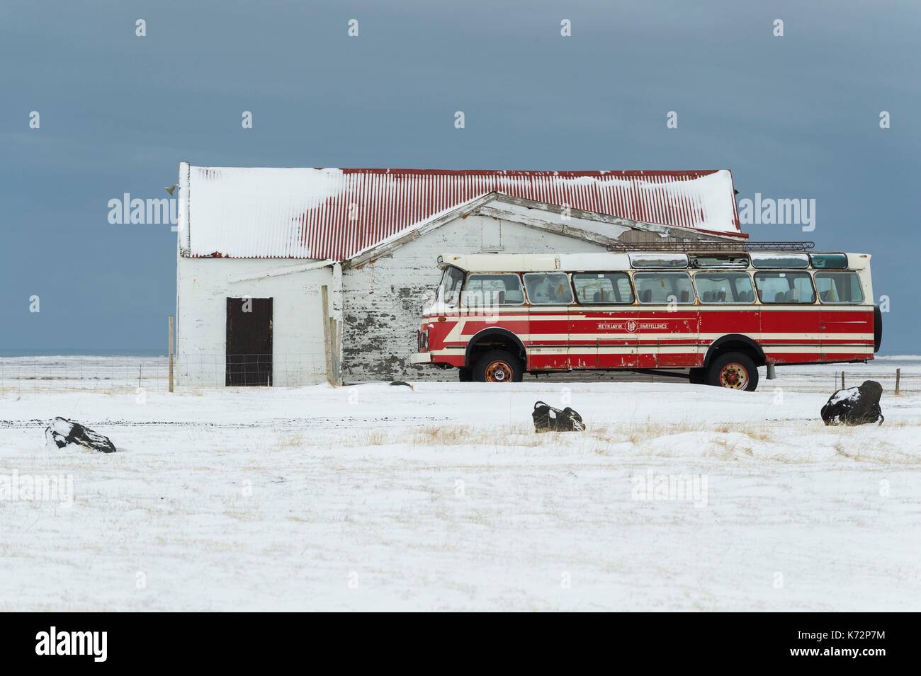 Iceland, West Iceland, Snaefellsnes Peninsula, old bus in front of a building Stock Photo