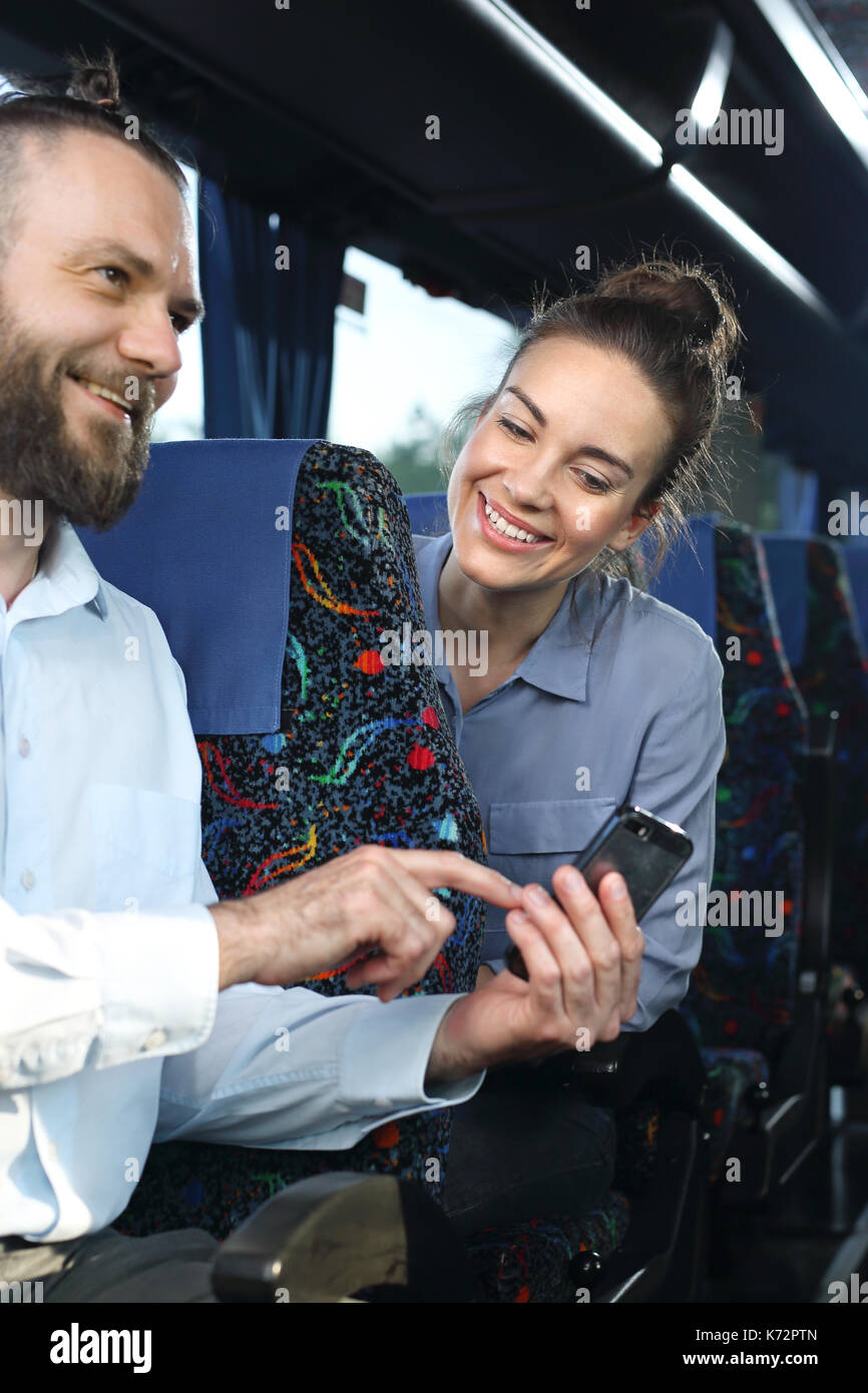 Travel by coach.Coach trip. Passenger speaks on the phone while traveling. Stock Photo