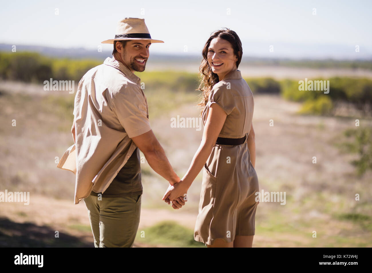 Smart couple holding hands hi-res stock photography and images - Alamy