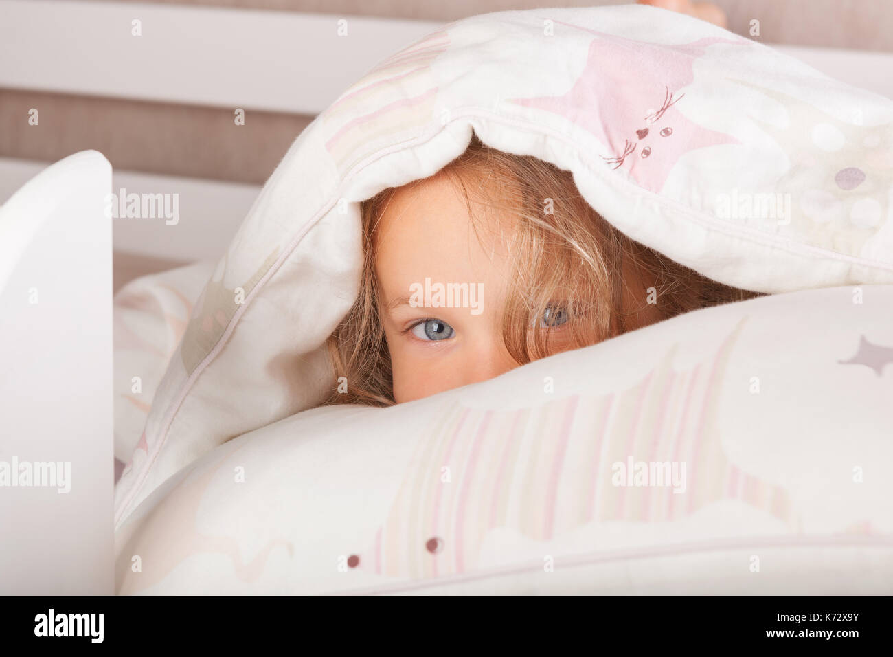 Cute kid Hiding Under The Blanket Stock Photo Alamy