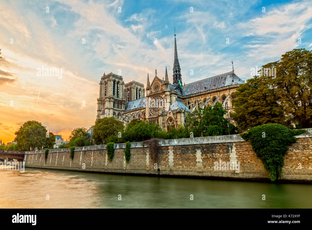 Sunset over the Notre Dame Church in Paris Stock Photo