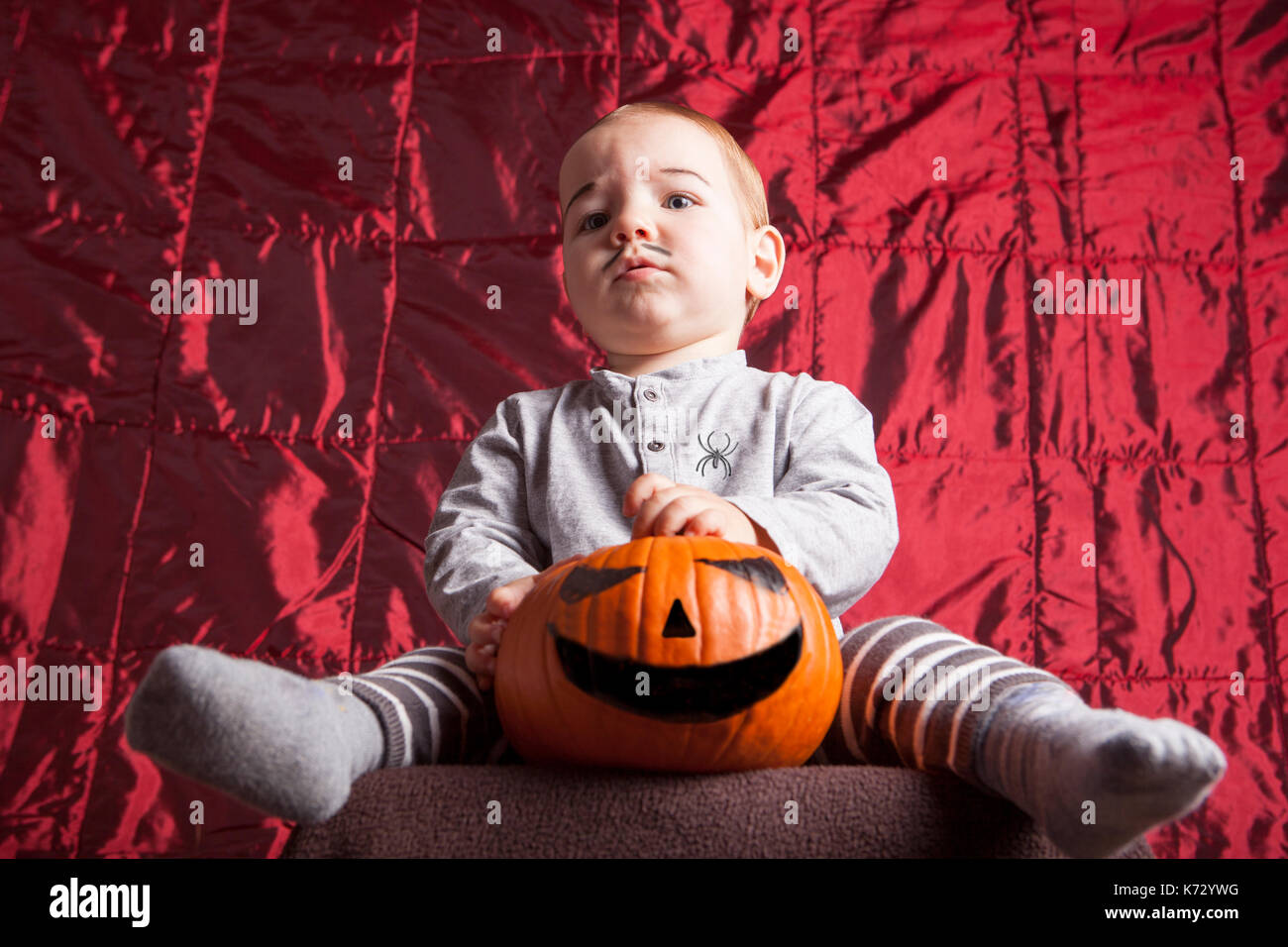 Portrait of a little boy dress up for halloween party. He has a serious suspecting expression Stock Photo