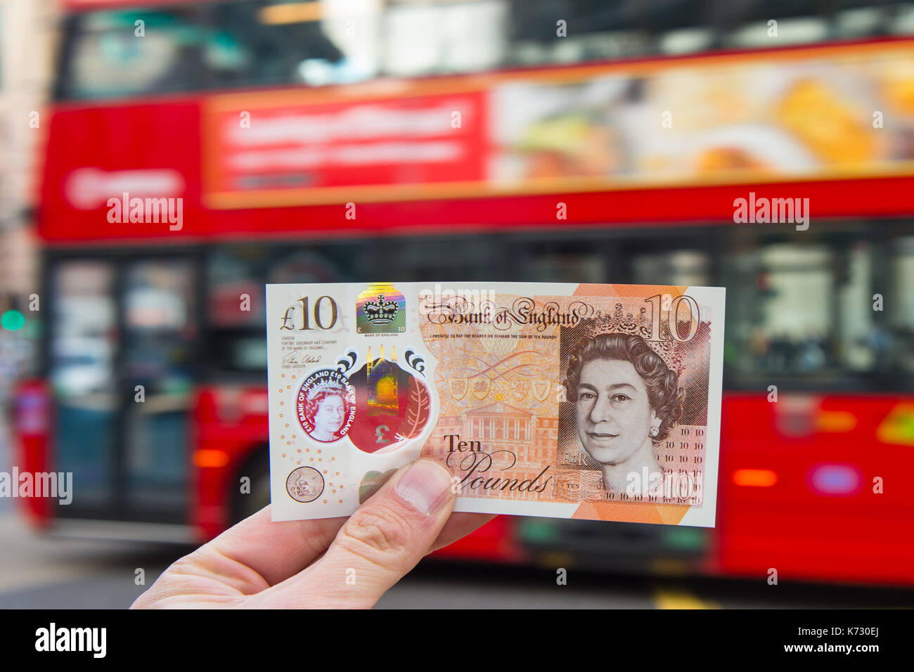 A man holds a new ten pound note featuring Jane Austen in London. Stock Photo