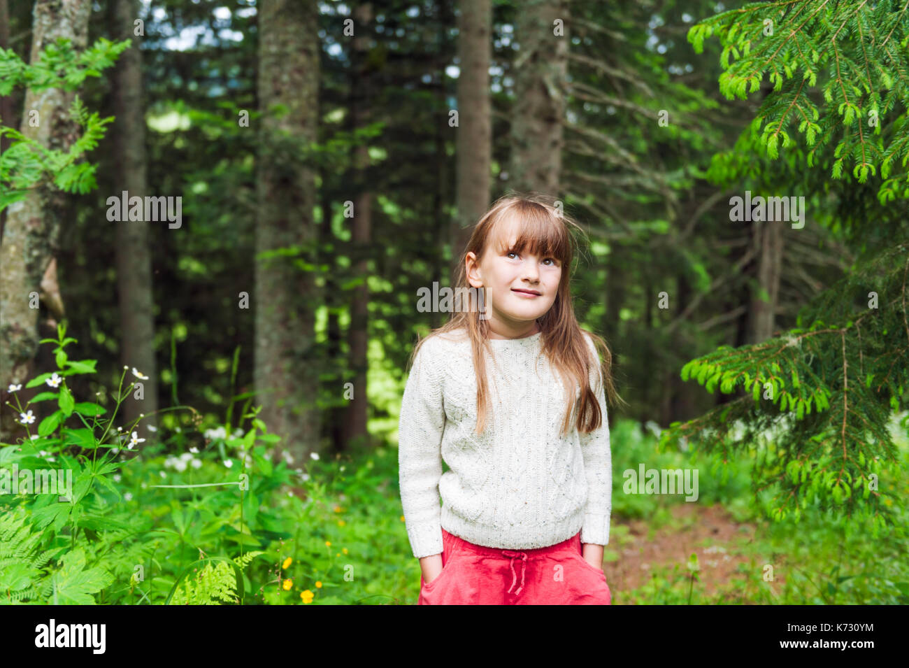 Outdoor portrait of little girl in the forest Stock Photo - Alamy