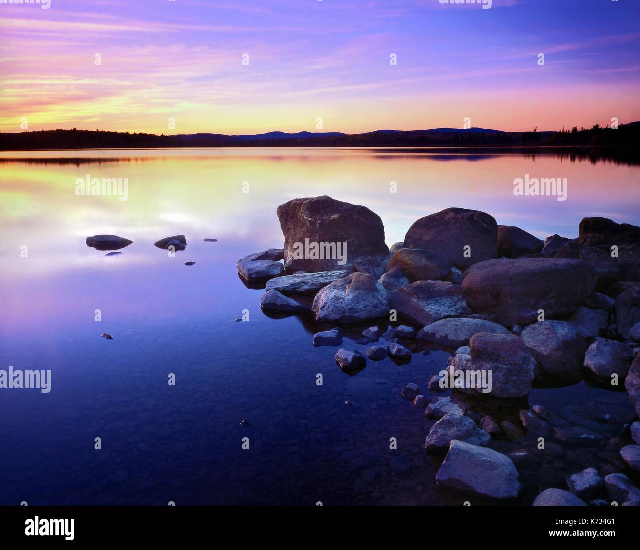 A view of a sunset over Big Wood Pond, Maine, USA Stock Photo Alamy