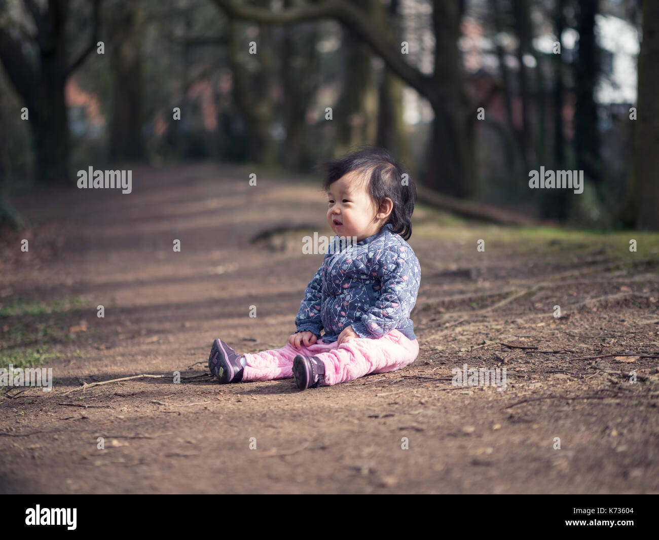 Spring Time Playing baby girl playing outdoor in spring time Stock Photo - Alamy