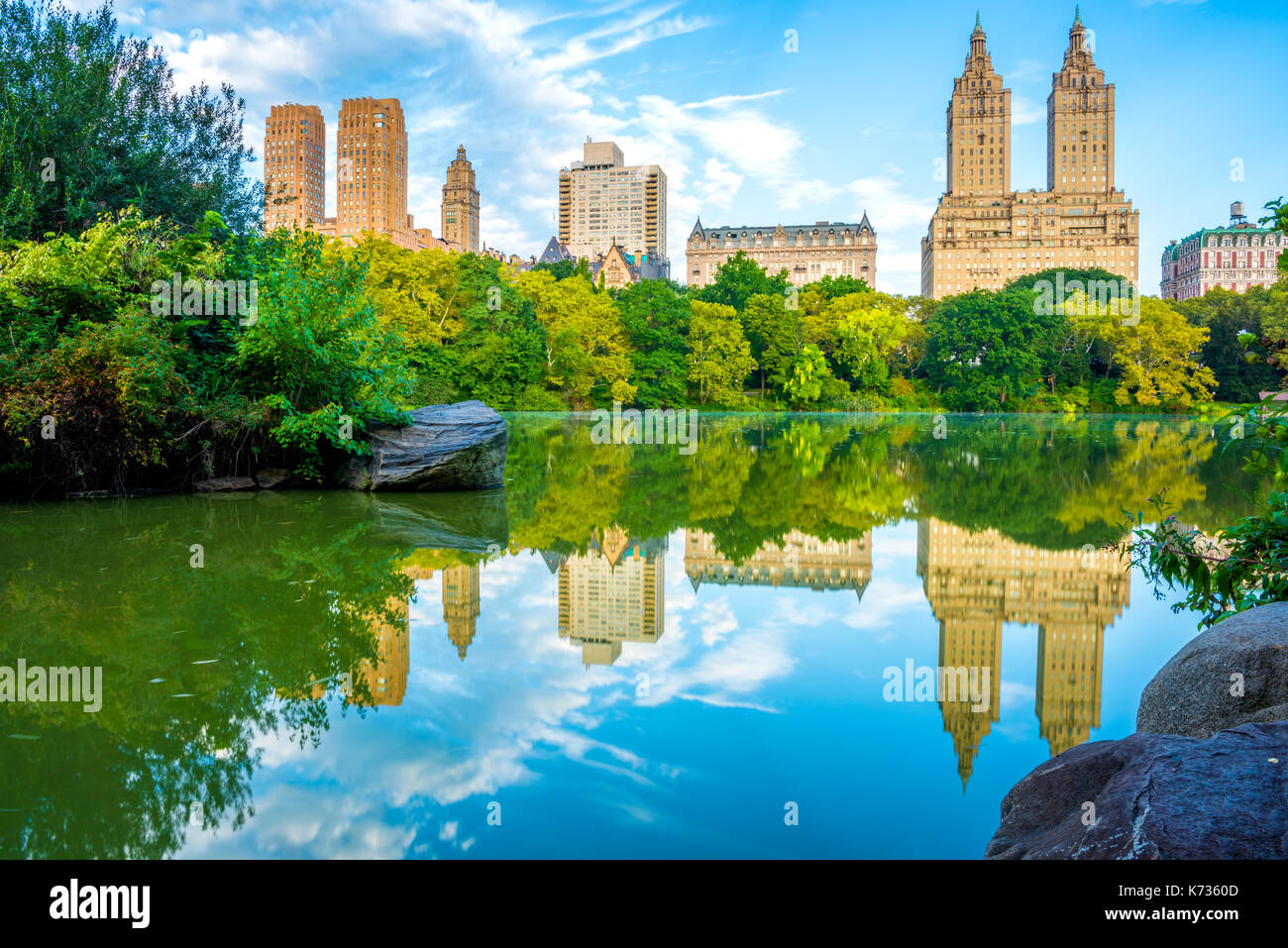 NYC skyline reflection in The Lake in Central Park. Lake on the foreground  and NYC skyline on the background. Beautiful early fall time Stock Photo -  Alamy