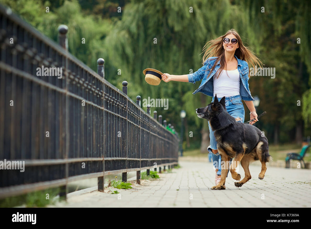 Girl walking dog hi-res stock photography and images - Alamy