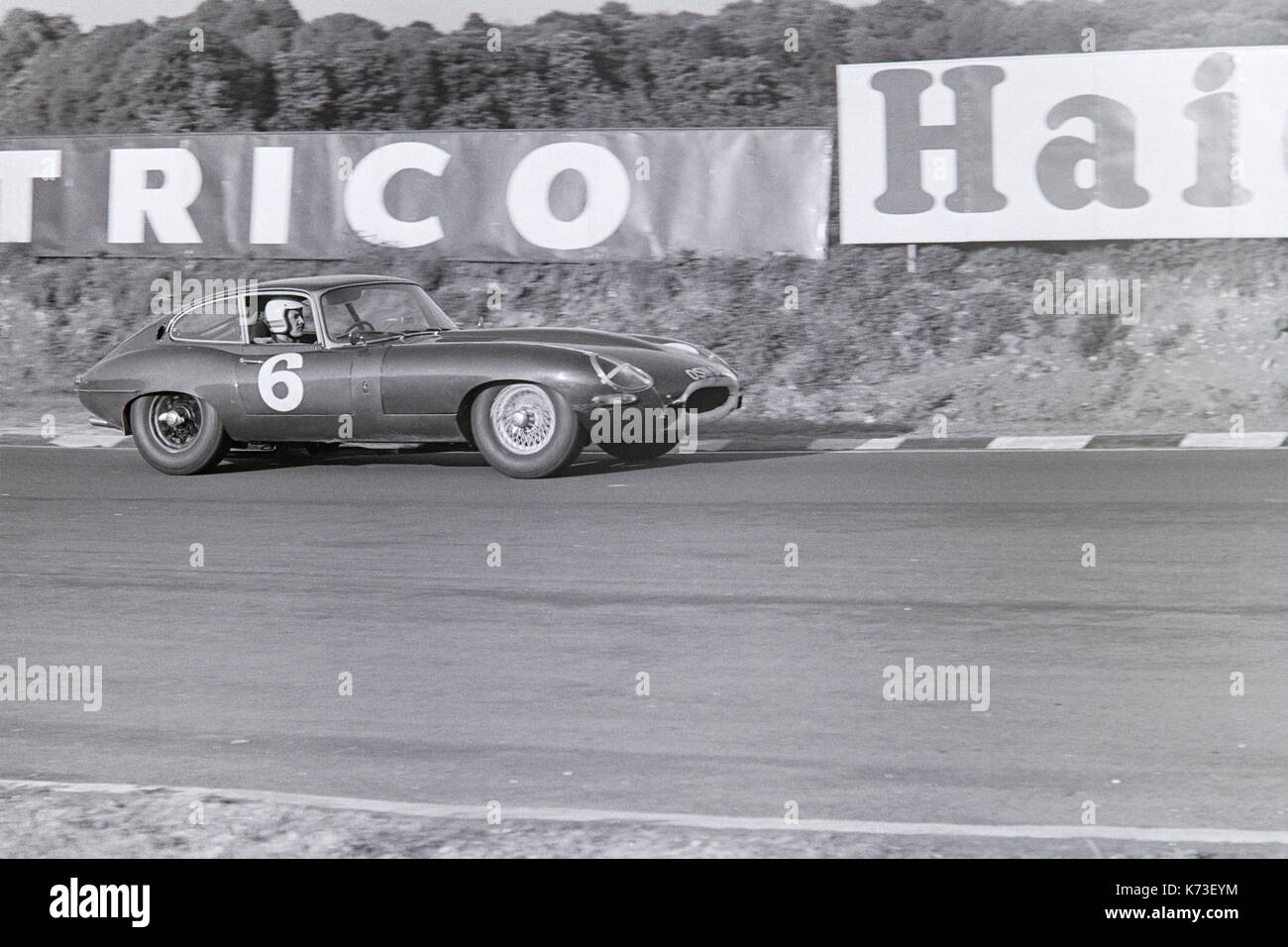 Jaguar E-Type  racing at Brands Hatch Motor racing circuit in England during the 1960s. Stock Photo