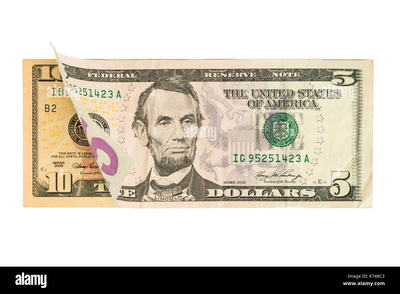 Five Dollar Bill On Top Of Ten Dollar Bill Stock Photo - Alamy