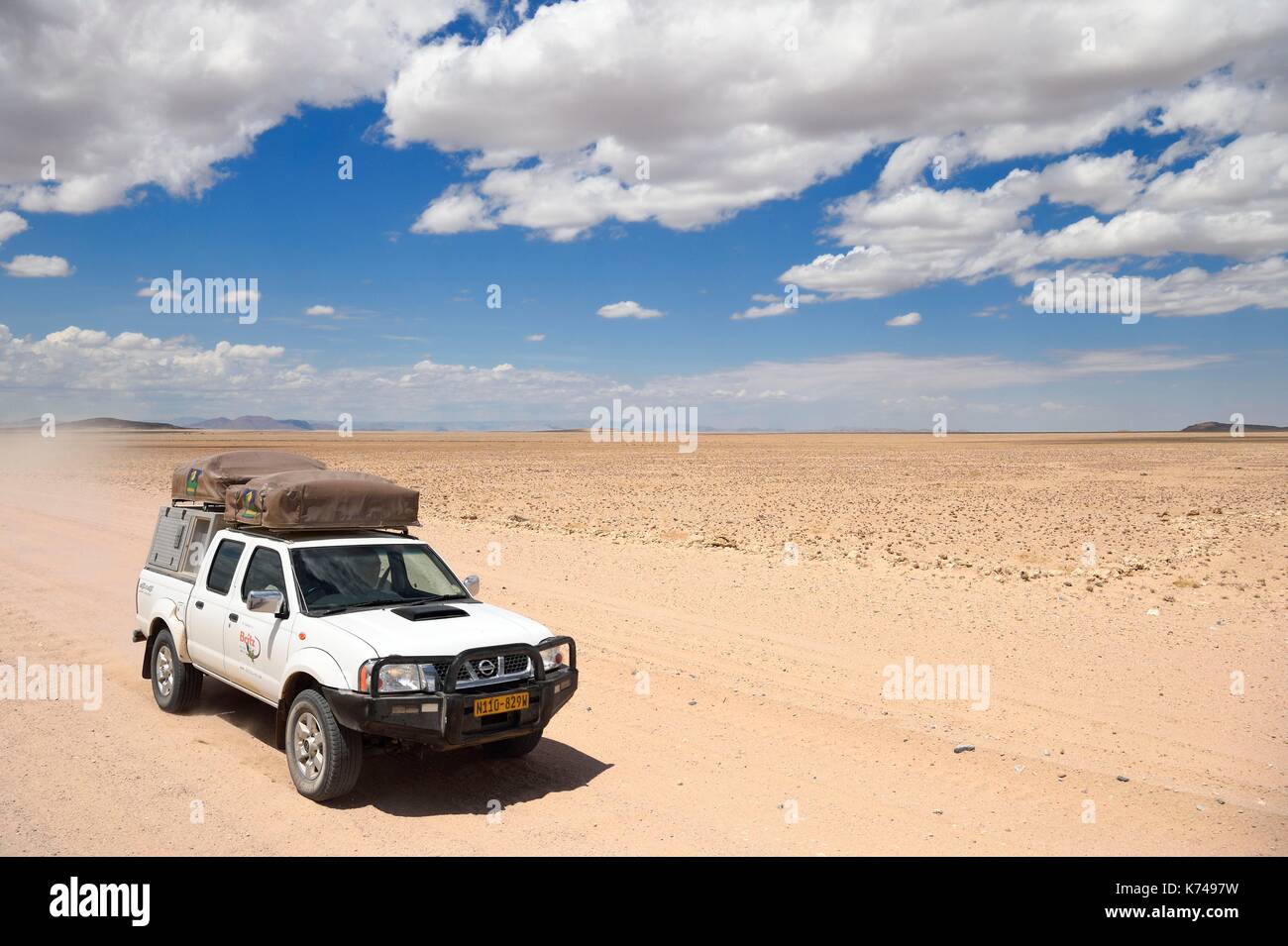 Namibia, Erongo region, Namib Naukluft National Park, Namib Desert, four-wheel drive vehicle on the C14 gravel road Stock Photo