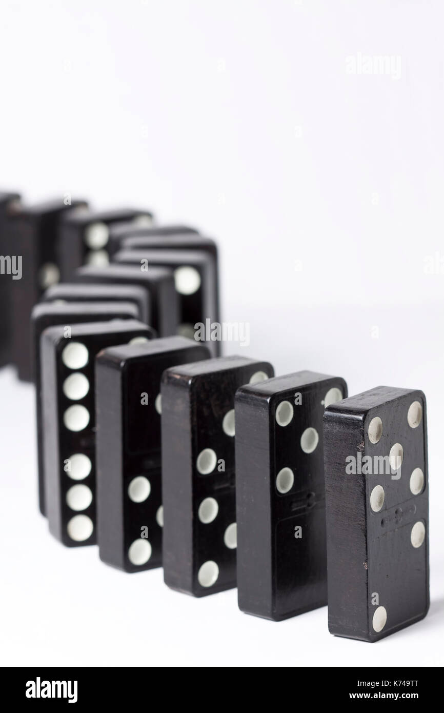Black Dominos Standing In S Curve Stock Photo