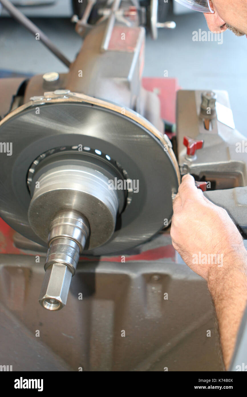 Mechanic working at Auto Repair Shop Stock Photo - Alamy