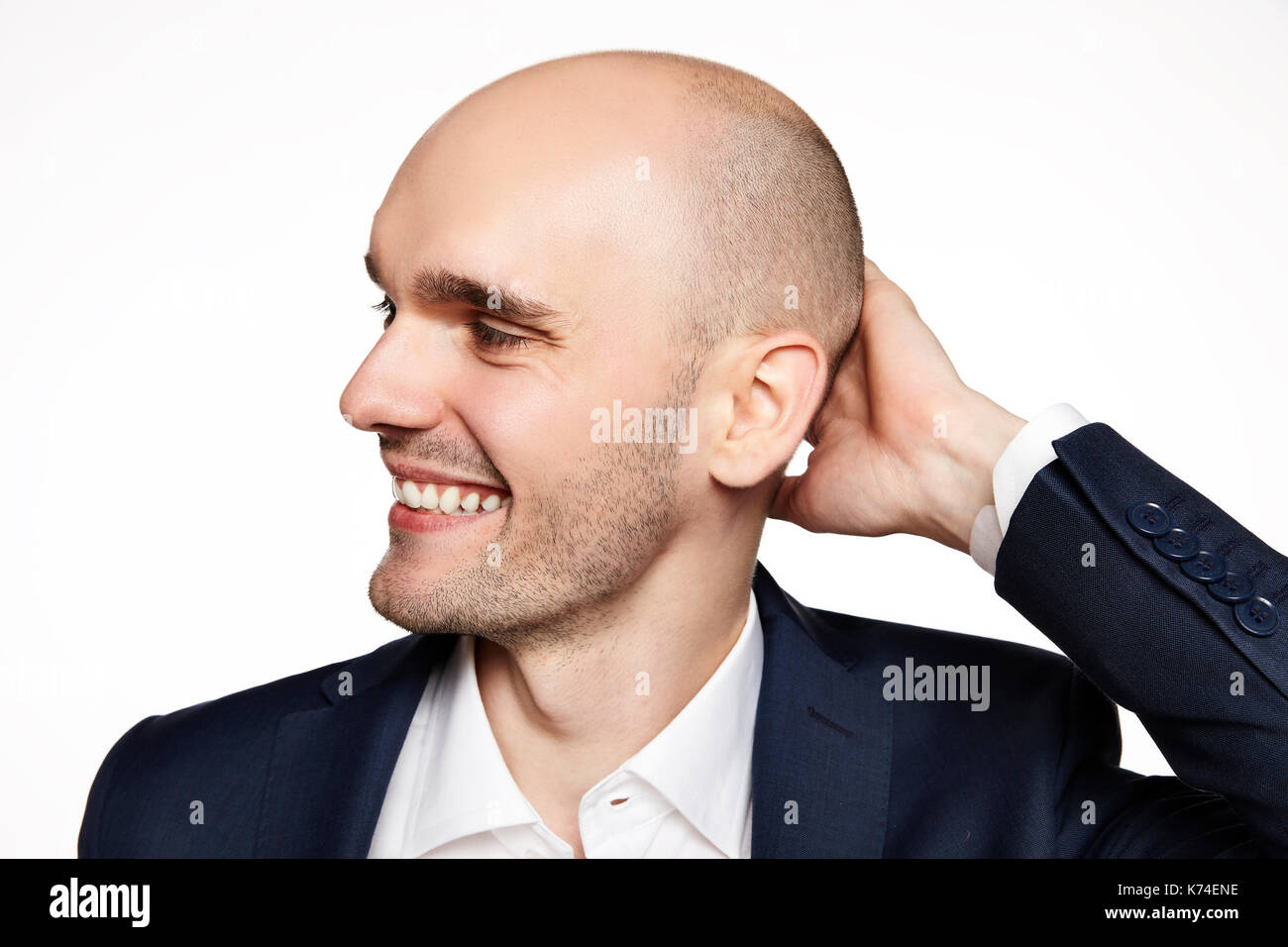 Side view of young man wearing suit. Stock Photo